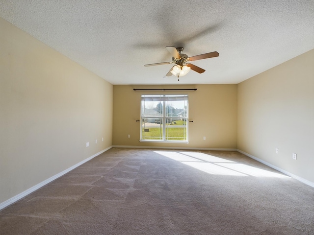 3098 Border Creek Dr, Crestview, FL 32539 - spare room featuring ceiling fan, a textured ceiling, carpet flooring, and baseboards
