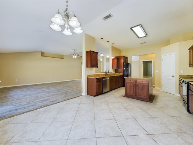 3098 Border Creek Dr, Crestview, FL 32539 - kitchen with light tile patterned flooring, visible vents, open floor plan, black appliances, and pendant lighting