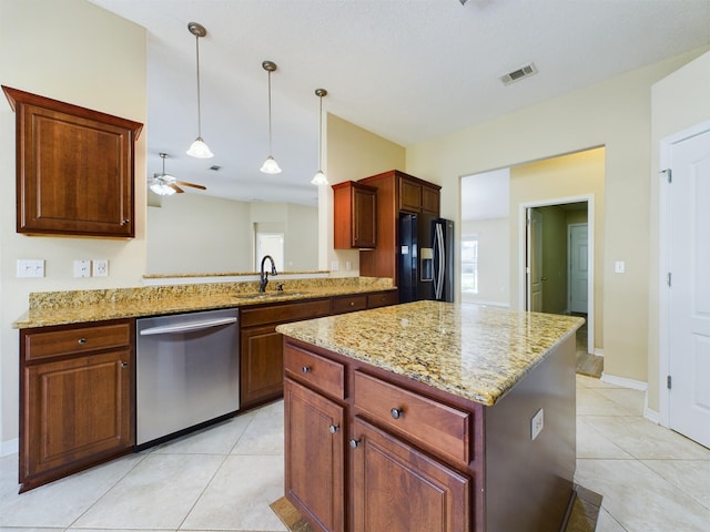 3098 Border Creek Dr, Crestview, FL 32539 - kitchen with visible vents, dishwasher, a center island, black fridge, and a sink