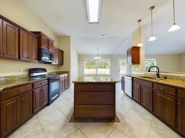 3098 Border Creek Dr, Crestview, FL 32539 - kitchen with hanging light fixtures, a sink, a kitchen island, dark stone countertops, and black appliances