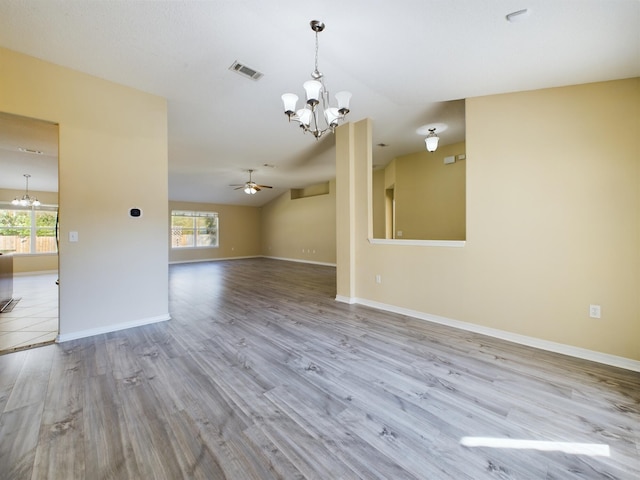 3098 Border Creek Dr, Crestview, FL 32539 - empty room featuring ceiling fan with notable chandelier, light wood-style flooring, visible vents, and baseboards