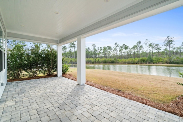 view of patio featuring a water view