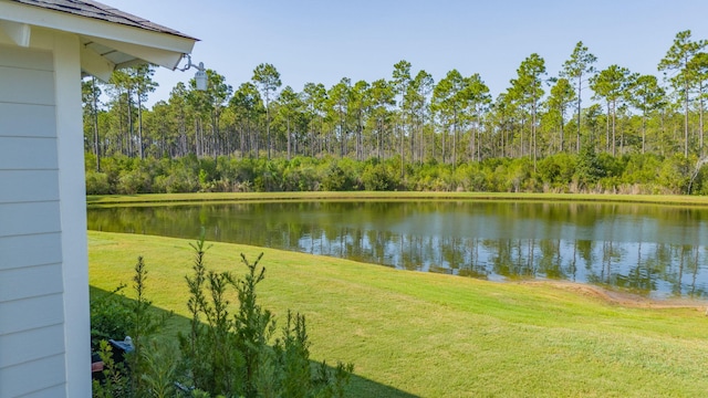 view of water feature with a forest view