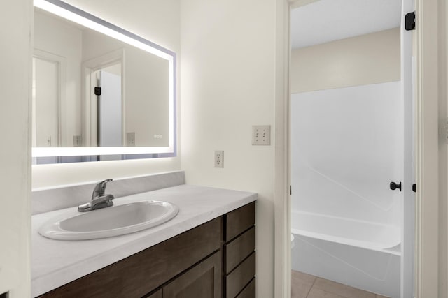 full bath featuring toilet, shower / bathing tub combination, tile patterned flooring, and vanity