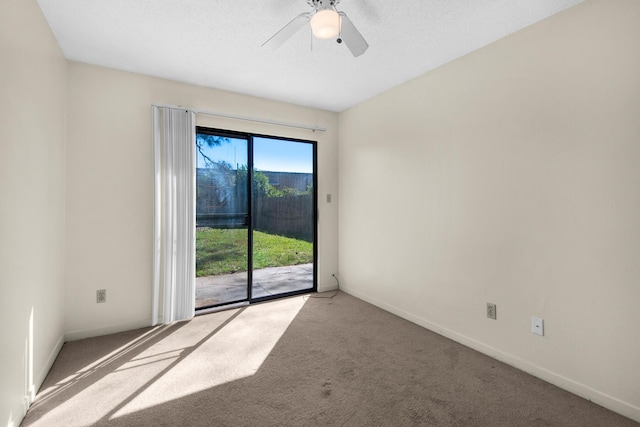 spare room featuring baseboards, ceiling fan, and light colored carpet