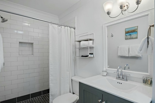 bathroom featuring toilet, a tile shower, and vanity