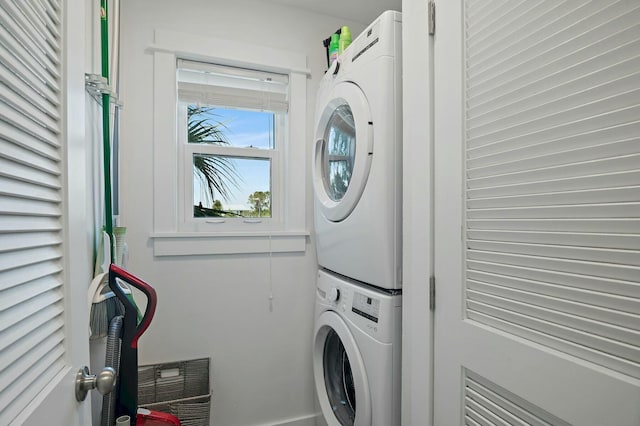 laundry room with laundry area and stacked washing maching and dryer