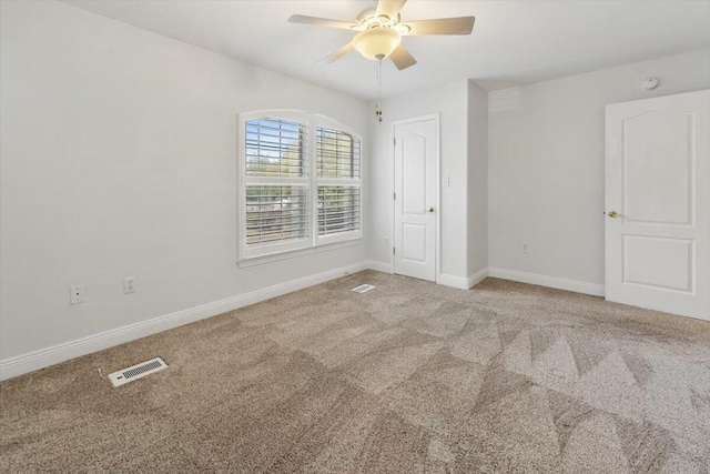 unfurnished bedroom with visible vents, baseboards, carpet, and ceiling fan