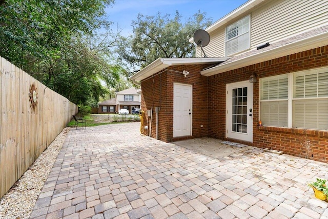 view of patio featuring fence