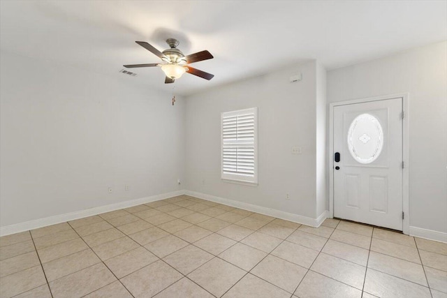 foyer entrance with light tile patterned floors, visible vents, baseboards, and ceiling fan