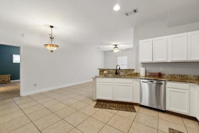 kitchen with stainless steel dishwasher, a peninsula, white cabinets, and visible vents