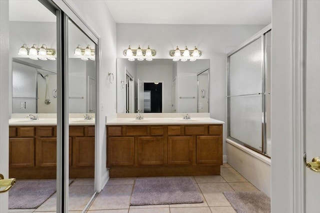 bathroom featuring double vanity, a sink, and tile patterned flooring