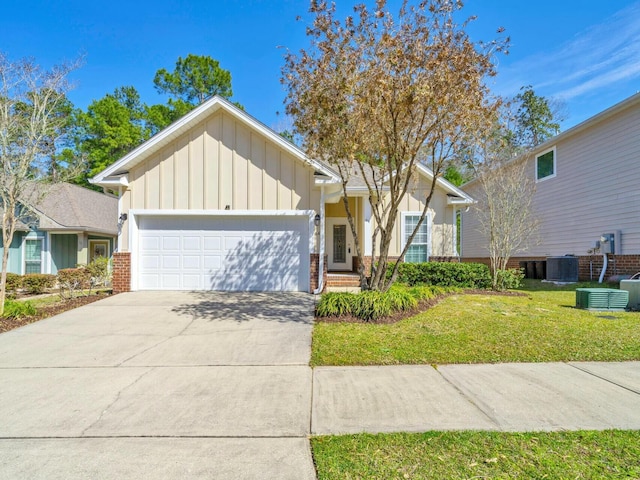 ranch-style home with a garage, brick siding, driveway, a front lawn, and board and batten siding