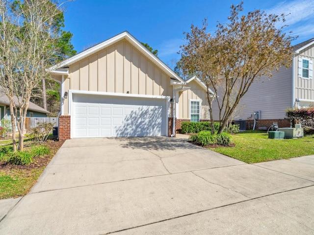 ranch-style home featuring driveway, brick siding, board and batten siding, and an attached garage