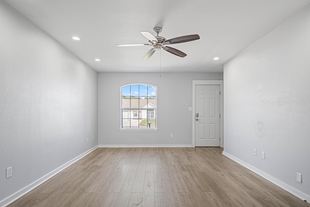 empty room with recessed lighting, baseboards, ceiling fan, and light wood finished floors