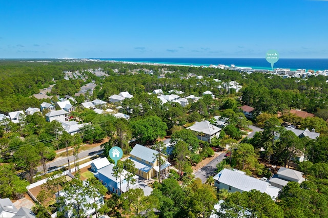 drone / aerial view with a water view and a residential view