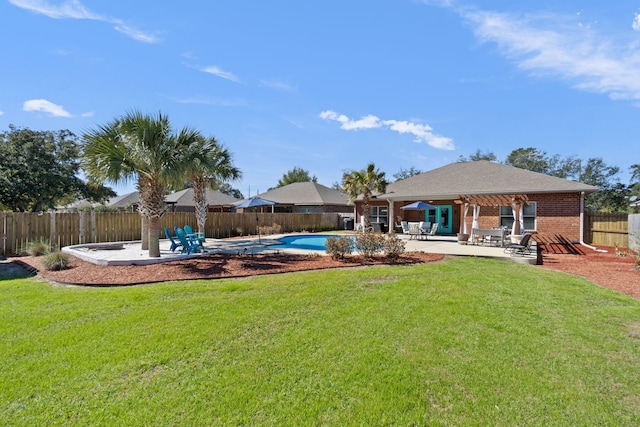 exterior space with a patio, a fenced backyard, and a fenced in pool