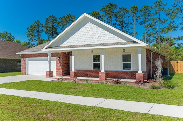 view of front of house with brick siding, a porch, concrete driveway, an attached garage, and cooling unit