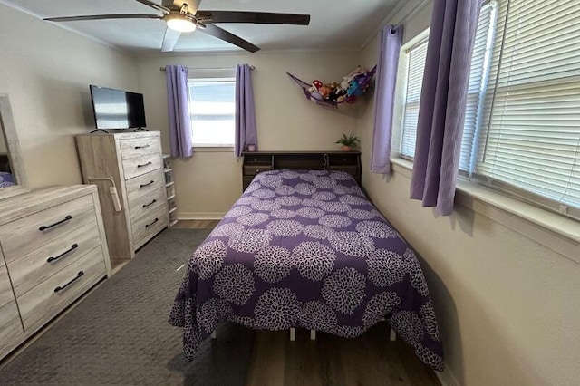 bedroom featuring ornamental molding and a ceiling fan