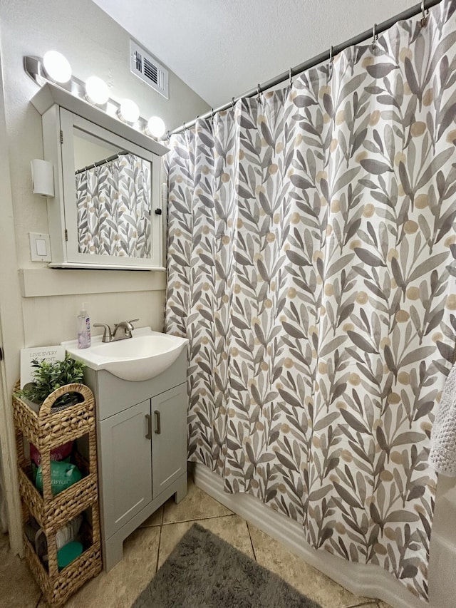 45 NE Arizona Dr, Fort Walton Beach, FL 32548 - full bathroom with vanity, a shower with curtain, and tile patterned flooring
