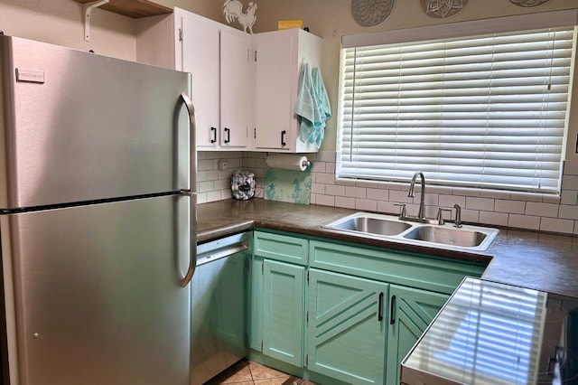 45 NE Arizona Dr, Fort Walton Beach, FL 32548 - kitchen with stainless steel appliances, backsplash, green cabinetry, and white cabinets