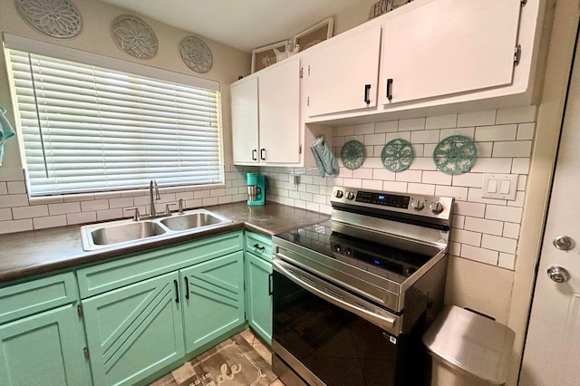 45 NE Arizona Dr, Fort Walton Beach, FL 32548 - kitchen featuring electric range, tasteful backsplash, white cabinetry, and light tile patterned flooring