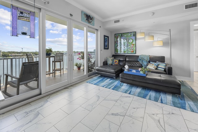 living room with marble finish floor, visible vents, crown molding, and baseboards