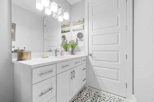 bathroom with tile patterned floors and vanity