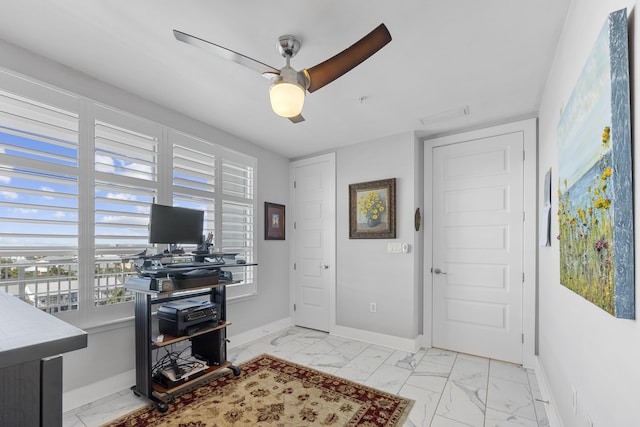 office space with a ceiling fan, marble finish floor, visible vents, and baseboards