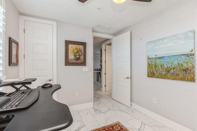 interior space with marble finish floor and baseboards