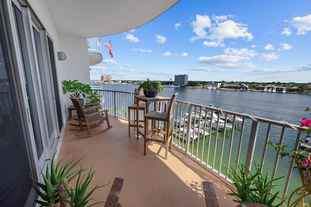 balcony featuring a water view