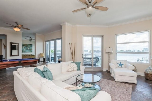 living area with baseboards, billiards, ornamental molding, and a ceiling fan