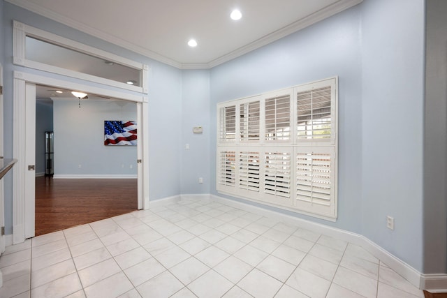 spare room with recessed lighting, light tile patterned flooring, crown molding, and baseboards