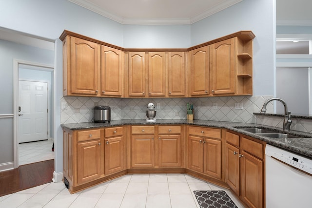 kitchen featuring brown cabinetry, dishwasher, dark stone countertops, open shelves, and a sink