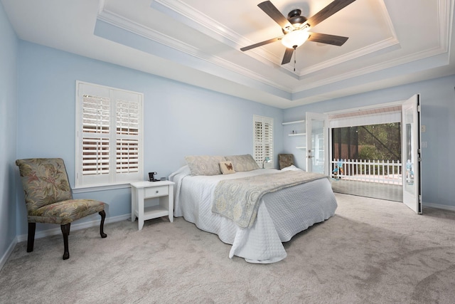 bedroom featuring light carpet, access to outside, a tray ceiling, and baseboards