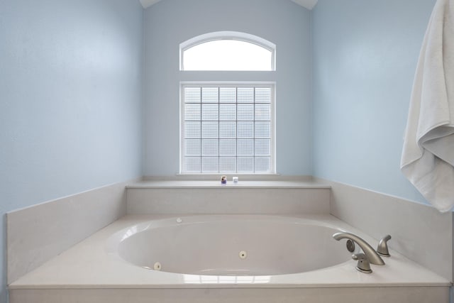 full bath featuring a whirlpool tub