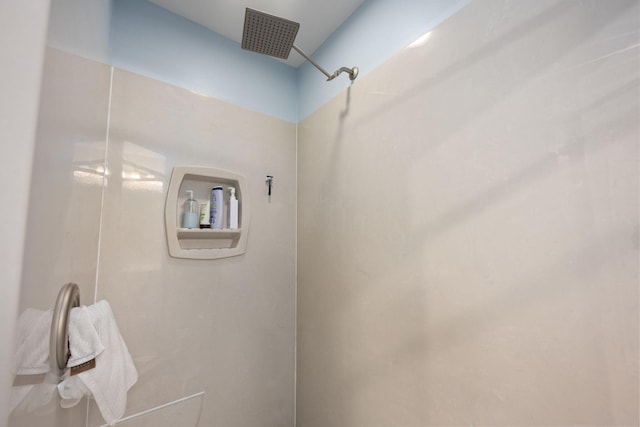 bathroom with a tile shower