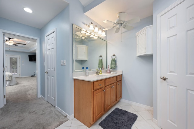 bathroom featuring tile patterned flooring, ceiling fan, vanity, and baseboards