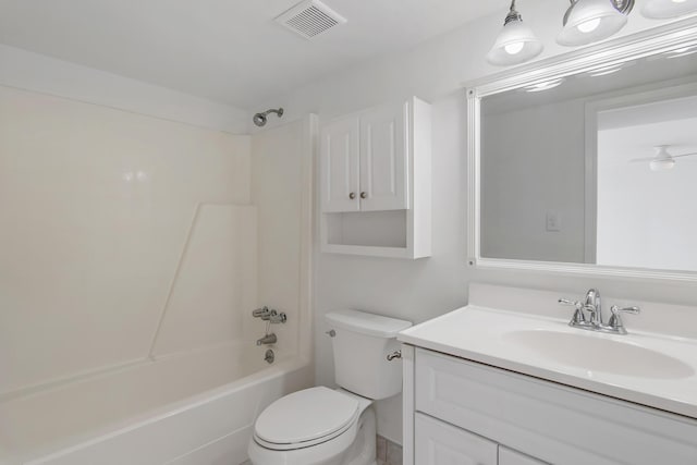 full bathroom with toilet, washtub / shower combination, visible vents, and vanity