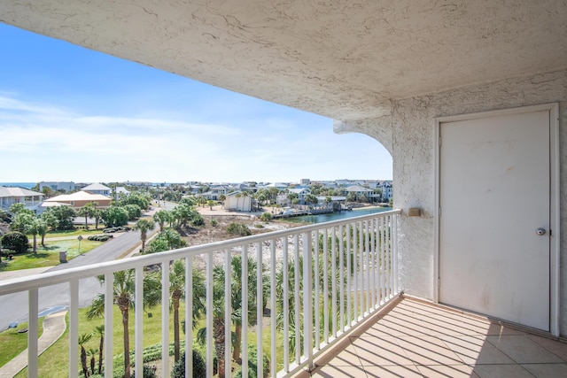 balcony featuring a water view