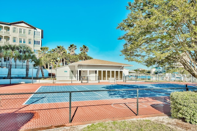 view of swimming pool featuring fence