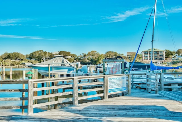 view of dock featuring a water view and boat lift