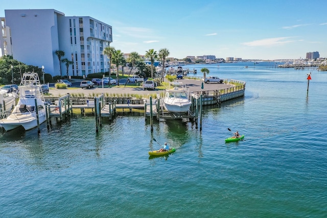 dock area with a water view and boat lift