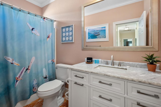 full bath featuring toilet, vanity, and crown molding