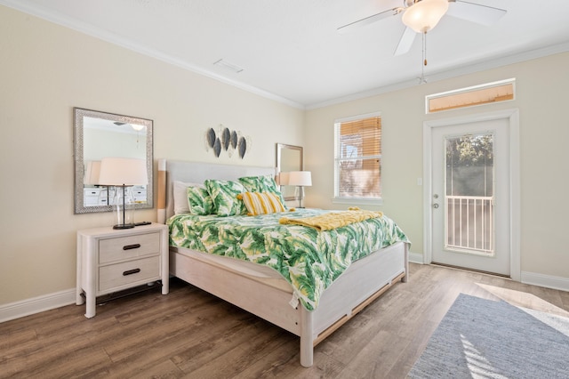 bedroom featuring access to exterior, dark wood finished floors, and crown molding