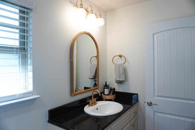 bathroom featuring a wealth of natural light and vanity