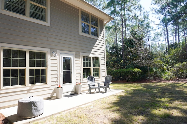 exterior space featuring a yard and a patio area