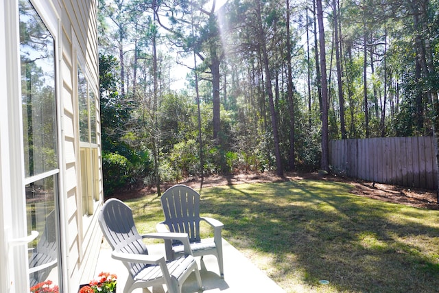 view of yard featuring a patio and fence