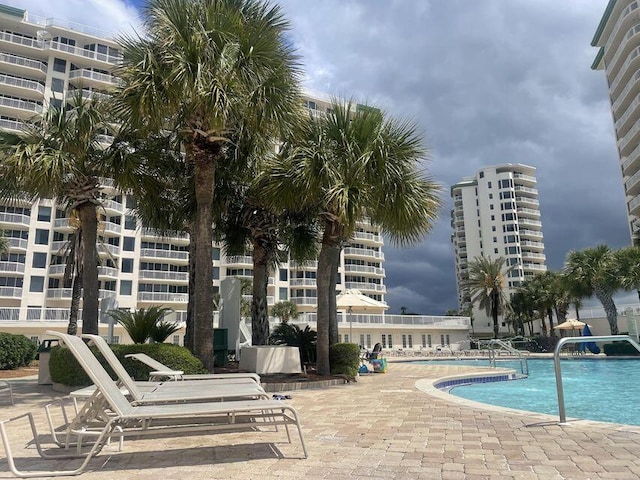 community pool with a patio