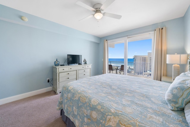 bedroom with a ceiling fan, access to outside, light colored carpet, and baseboards